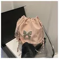 Pink drawstring bucket bag featuring a silver metal butterfly and chain strap - Pink Without Pendant