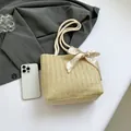 Beige woven straw tote bag with white cotton rope handles and heart print silk scarf detail - Khaki