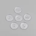 Set of six clear round two-hole resin buttons in a neat geometric grid arrangement - Clear