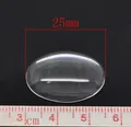 Detailed view of a 25mm oval transparent glass cabochon with metric ruler scale - 25x18mm-30 Pieces/Pack / Clear