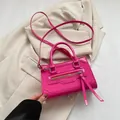 Magenta glossy leather crossbody bag with long tassels and double top handles - Rose Red