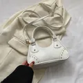 White semi-circular shoulder bag with golden studs and adjustable long strap - White