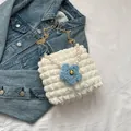 White popcorn textured crossbody bag with pearl handle, chain strap, and blue flower charm - With Pearl Chain Style / White