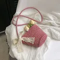 Red and white checkered woven bucket bag featuring a large cream lace bow and long strap - With Scarf Style / Red