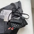 Glossy black patent leather crossbody bag with quilted diamond pattern and silver chain - Black