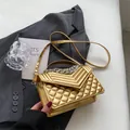 Glossy metallic gold quilted crossbody bag with silver chain and top handle strap - Gold