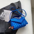 Metallic electric blue quilted crossbody bag with silver chain and V-pattern stitching - Blue