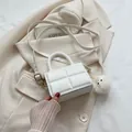 White mini crossbody bag with quilted texture and a cute white pom-pom pendant - With Pendant / White