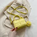 Yellow mini crossbody bag with quilted PU leather texture and plush ball charm accessory - With Pendant / Yellow