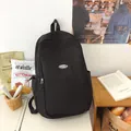 Minimalist black large capacity backpack with fashion logo for high school students - Black