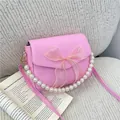 Elegante rosa Mini-Handtasche mit Perlengriff und Netzschleife für Damenmode - Rosa