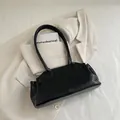 Minimalist black faux leather tote bag with long handles and polished oil-wax finish - Black