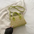 Avocado green cherry print pillow bag with top handles and detachable shoulder strap - Green