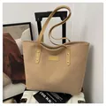 Detail of khaki corduroy tote bag with fashion logo and rivet-reinforced shoulder straps - Khaki