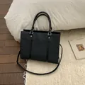 Elegant black textured tote bag with herringbone embossing and silver stud details - No Pendant / Black