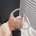 Pink minimalist crossbody bag with dual bow accents and silver metal hardware - Pink