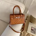 Elegant brown leather crossbody bag with yellow GA embroidery and silver twist lock - Brown