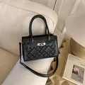 Black PU leather crossbody bag with geometric embroidery and silver rotating lock - Black