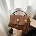 Brown vintage leather handbag with gold metal hardware and adjustable shoulder strap - Brown
