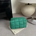 Quilted nylon makeup bag in emerald green with puffy checkered design and zipper closure - Green
