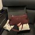 Deep red faux suede underarm bag with side bows and silver studs in a gift box - Red