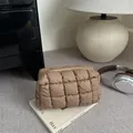 Quilted brown nylon puff makeup bag with padded grid texture and zipper closure - Brown