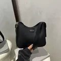 Matte black leather bucket bag with gold fashion lettering and adjustable shoulder strap - No Pendant / Black