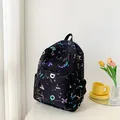 Casual black canvas backpack with colorful letter prints and splatter design for students - Black