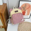 Corduroy backpack for women featuring pink and yellow contrast with cute 3D ears design - Pink