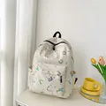 Minimalist cream canvas backpack featuring colorful letter print and splatter design - Off White