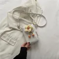 White floral lace mini crossbody phone bag with yellow flower charm and thin strap - White