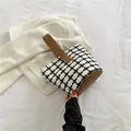 Black and white plaid tweed bucket bag with brown leather handles and base - White