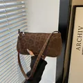 Chic brown leopard print faux suede baguette bag with sleek silver zipper detail - Brown