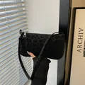Minimalist black leopard print baguette bag with velvet texture and zipper closure - Black