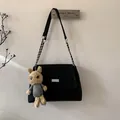 Black suede-like crossbody bag with silver chain strap and brown rabbit plush charm - Black With Pendant
