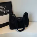 Minimalist black matte faux suede tote bag with wide shoulder strap and zipper closure - Obsidian Black