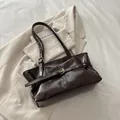 Deep brown oil wax leather tote bag with metallic eyelet belt detail for chic commuting - Brown