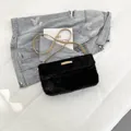 Chic black faux fur flap bag with golden metal logo plate and brown faux leather strap - Black