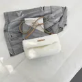 Chic white faux fur shoulder bag with brown leather strap and logo patch accent - White