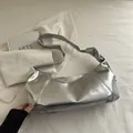 Metallic silver minimalist hobo bag with unique knotted strap detail for women - Bright Silver