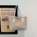 Chic beige monogram tote bag with brown M pattern and golden bow buckle detail - White