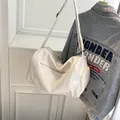 Large capacity white travel duffel bag with shoulder strap and multiple zip pockets - Off White