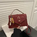 Minimalist burgundy crocodile pattern handbag with gold clasp and bead charm - With Pendant / Red