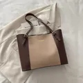 Brown and beige colorblock tote bag with top handles and adjustable gold buckles - Brown