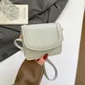 Pebbled leather mini shoulder bag in light grey-green with a slim strap and gold buckle - No Pendant / Gray