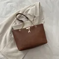 Retro brown faux leather tote bag with gold chain strap and deer charm detail - Brown