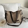 Grande borsa tote in tela kaki con tracolle marroni e pratiche tasche anteriori - Cachi