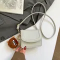 Mini light grey-green crossbody bag in litchi faux leather with a cute plush monster charm - With Pendant / Gray
