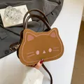 Funny bread cat crossbody bag in brown leather with pink embroidered cat face details - Brown