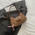 Brown vintage motorcycle shoulder bag with leather patchwork and metal rivet details - Brown